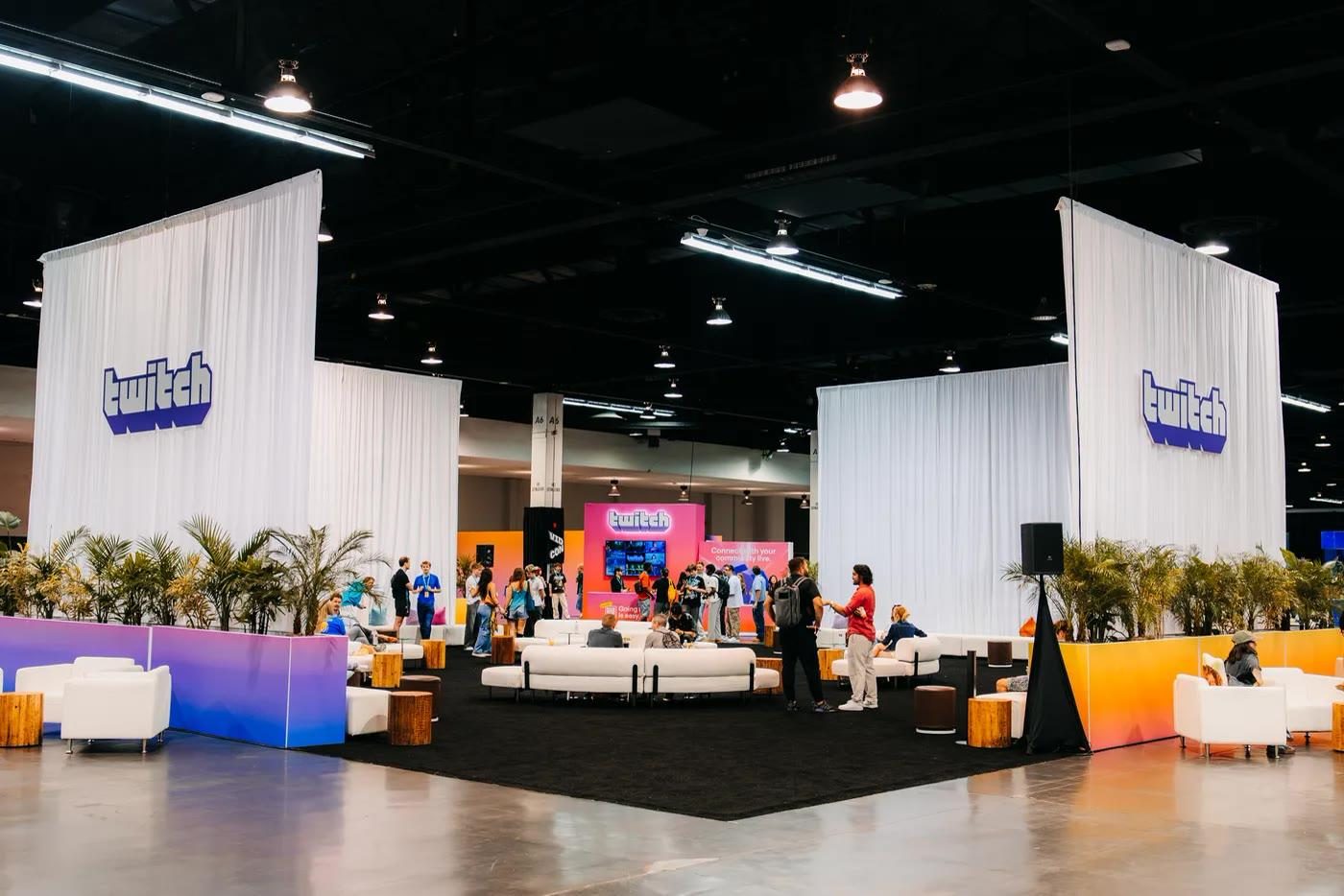 Twitch’s Recharge Lounge: hospitality behind ceiling-height drapery, VidCon 2026 expo floor, Anaheim