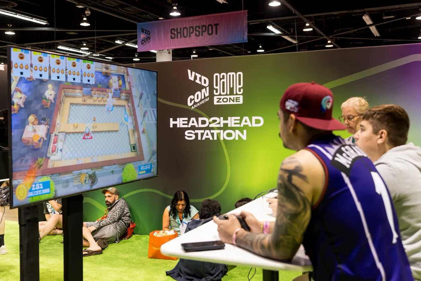 Game Zone’s Head2Head station: the attendee is the subject, VidCon 2026 expo floor, Anaheim