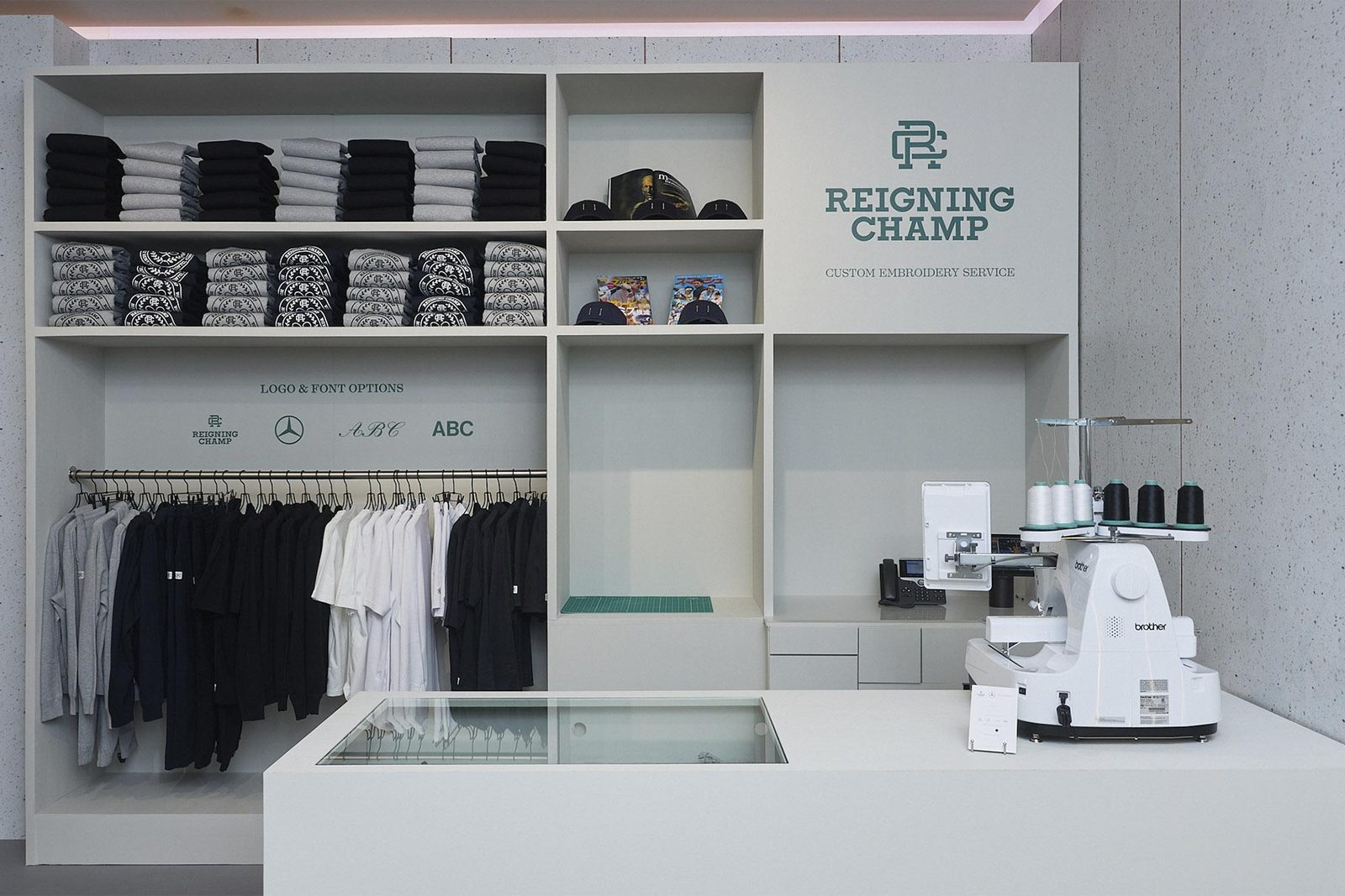 The Reigning Champ custom embroidery counter: collaborator credibility, built in, Mercedes-Benz Studio Toronto, Holt Renfrew Yorkville