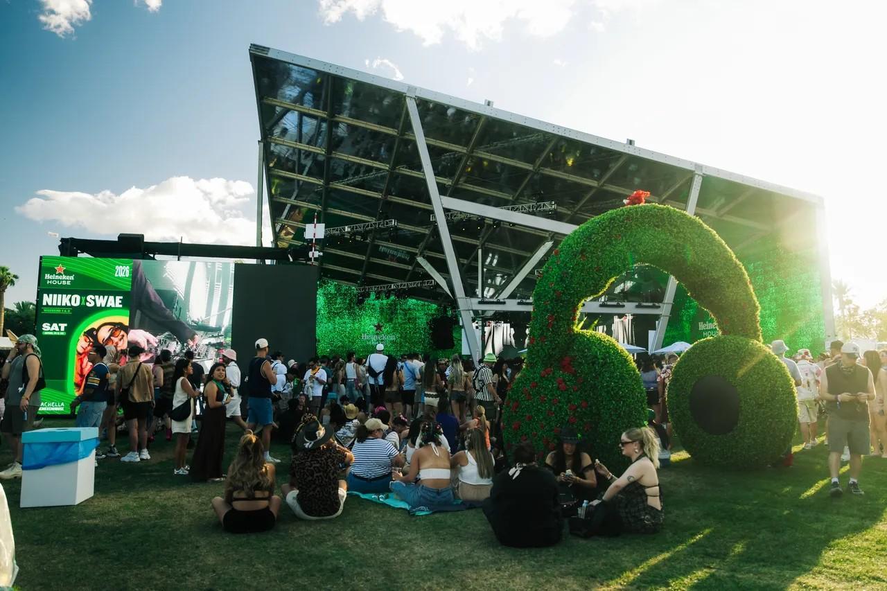 Heineken House lounge at Coachella 2026, speaker-wall build with fans gathered on the lawn