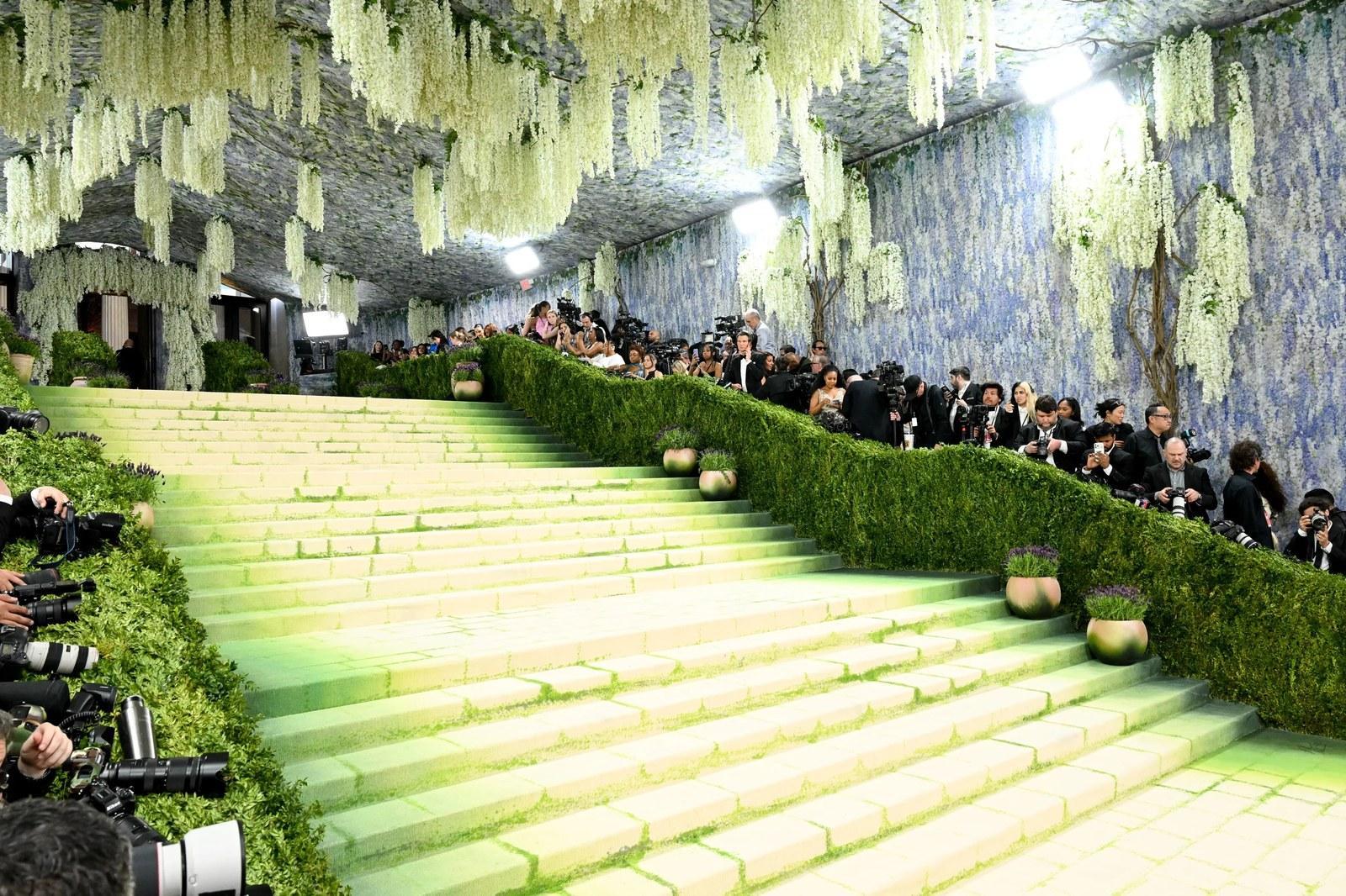 Met Gala 2026 Great Hall set design, suspended floral elements, hand-painted moss-covered carpet, immersive installation
