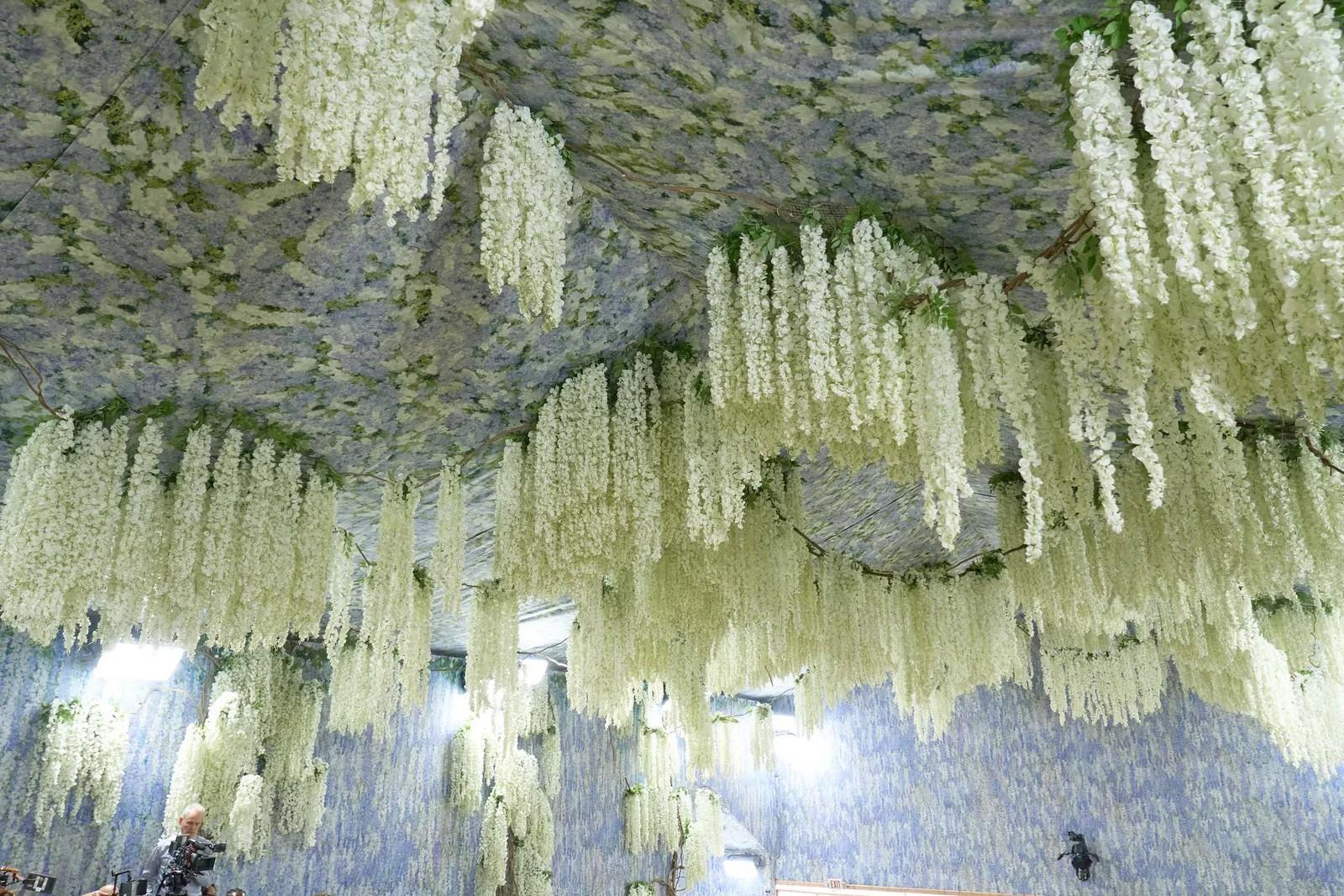 Met Gala 2026 ceiling: cascading white wisteria integrated directly into painted panels, no visible hardware